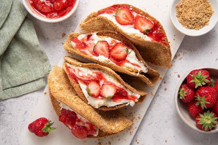 Straberry Cheesecake Tacos On Marble Board