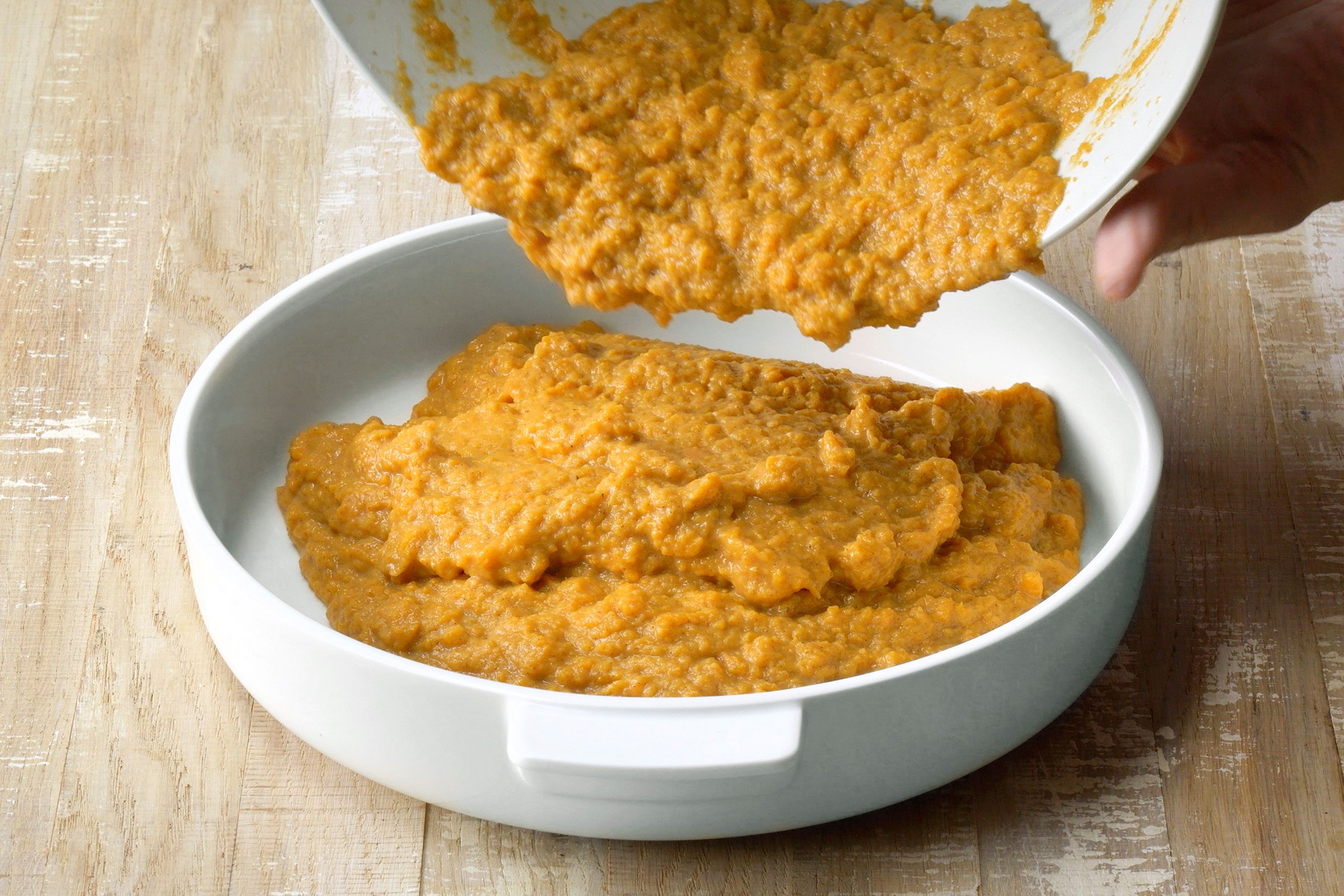 Transfer the mixture to a greased shallow 2-1/2-quart baking dish
