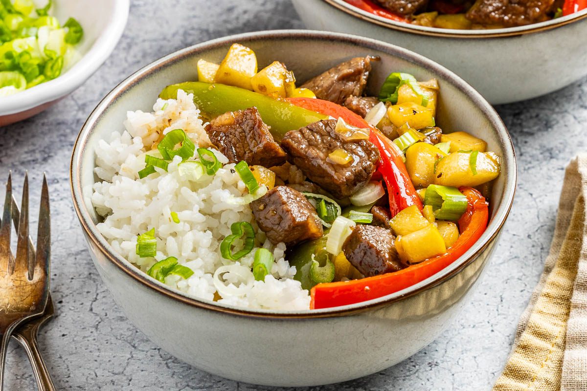 Taste of Home Sweet and Sour Beef photo of the finished recipe served with rice.