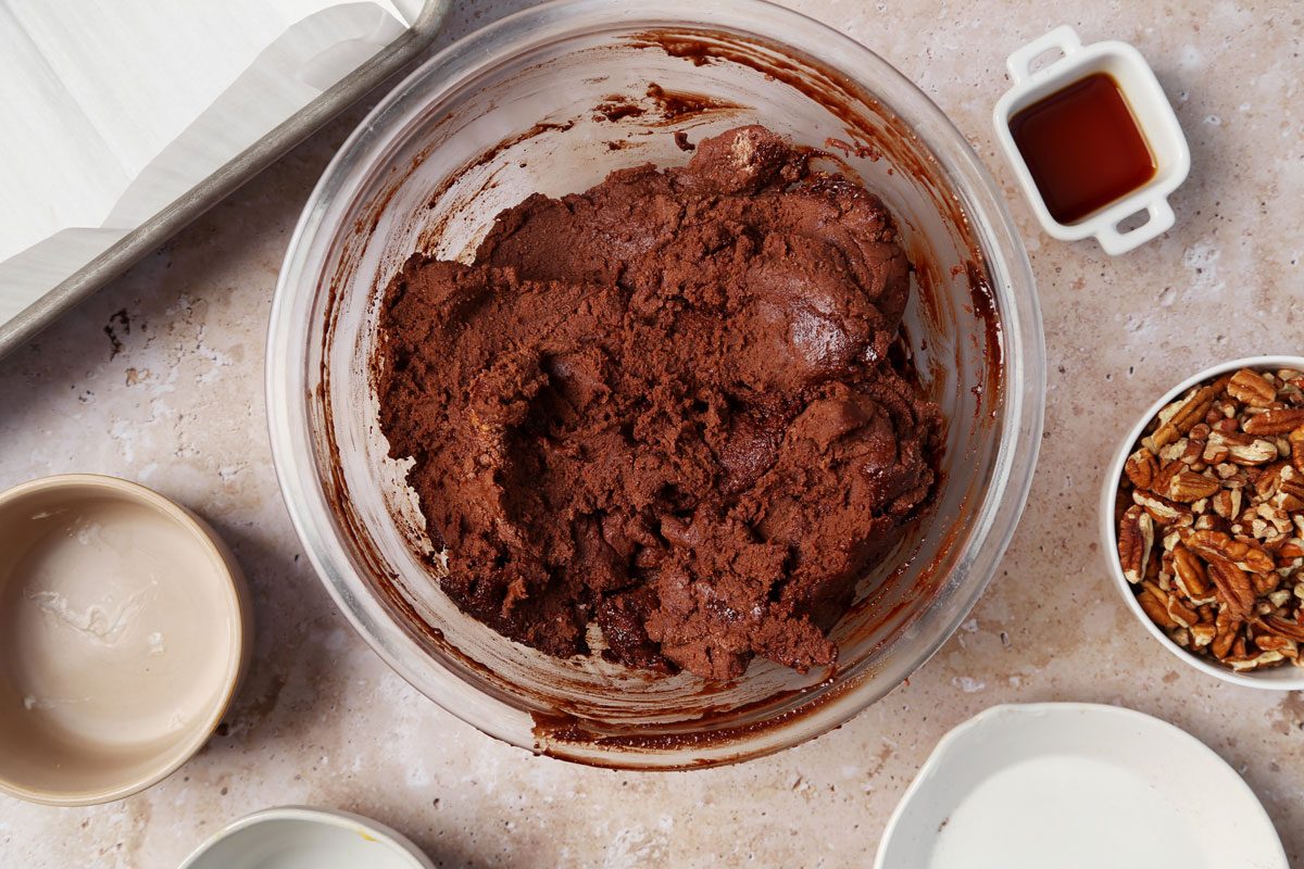 Velveeta FudgeaProcess of making Taste of Home's Velveeta Fudge in a large mixing bowl on a brown marble surface.