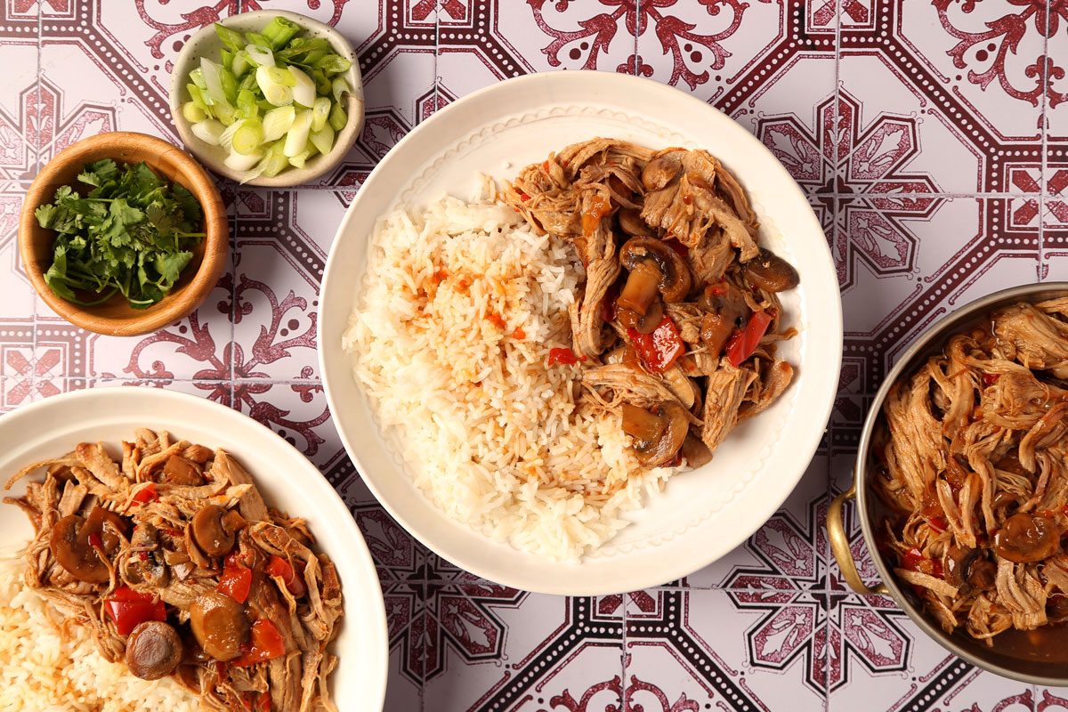 Process of making Taste of Home's Pork Bowl in a pressure cooker on a red and white tiled surface.