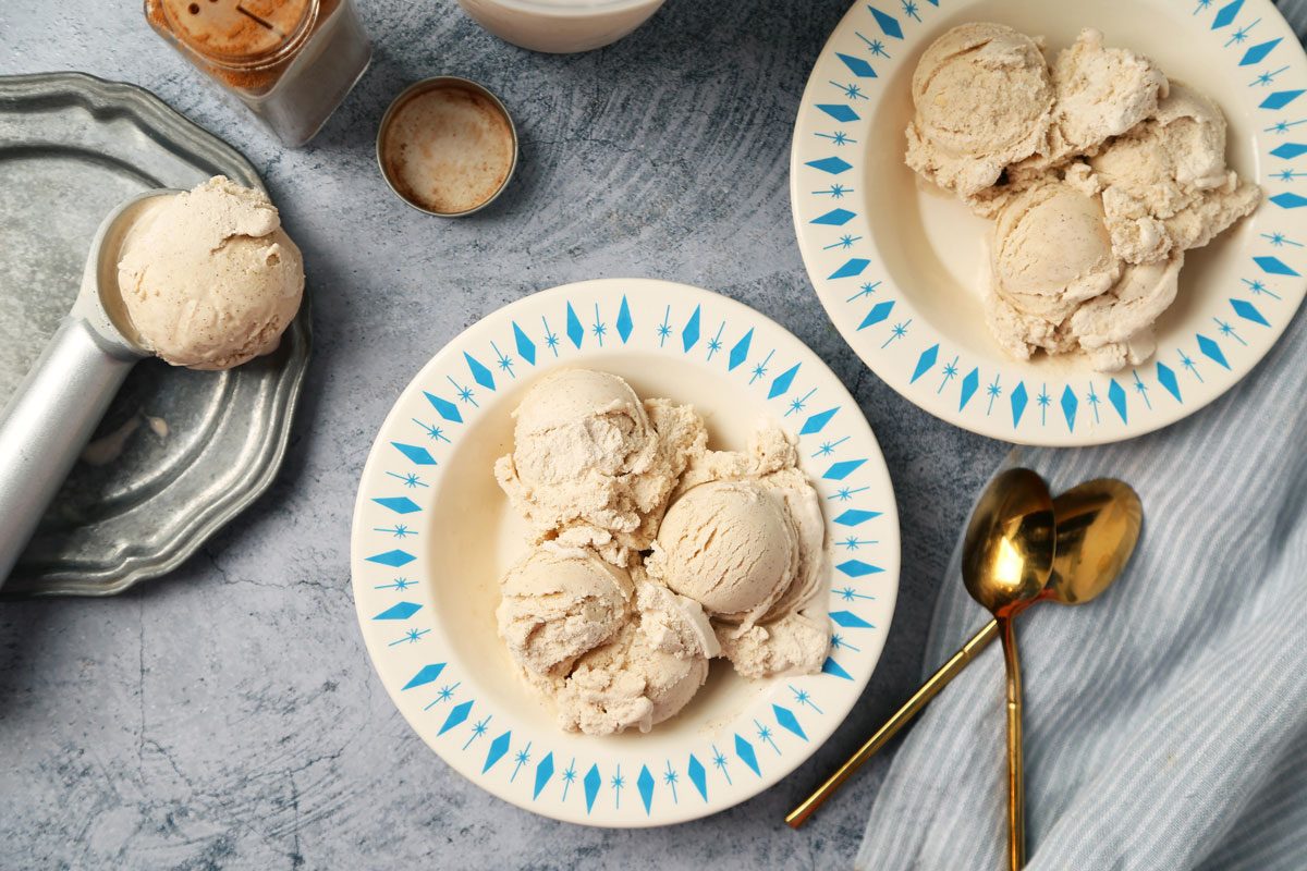 Close Up of Taste of Home's Cinnamon Ice Cream served in bowls on a blue surface.
