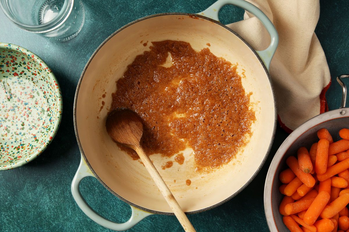 Process of making Taste of Home's Glazed Carrots served on a large dish with a green surface.