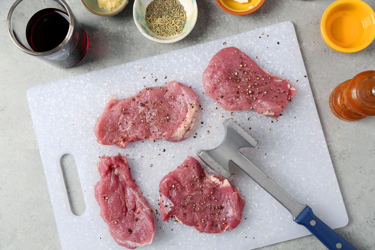 Process of making Taste of Home's Pork and Red Wine Sauce on a grey marble surface.