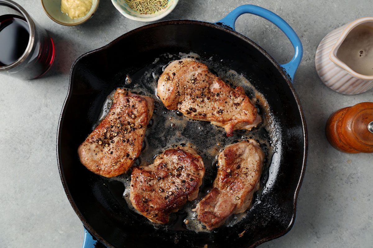 Process of making Taste of Home's Pork and Red Wine Sauce on a grey marble surface.