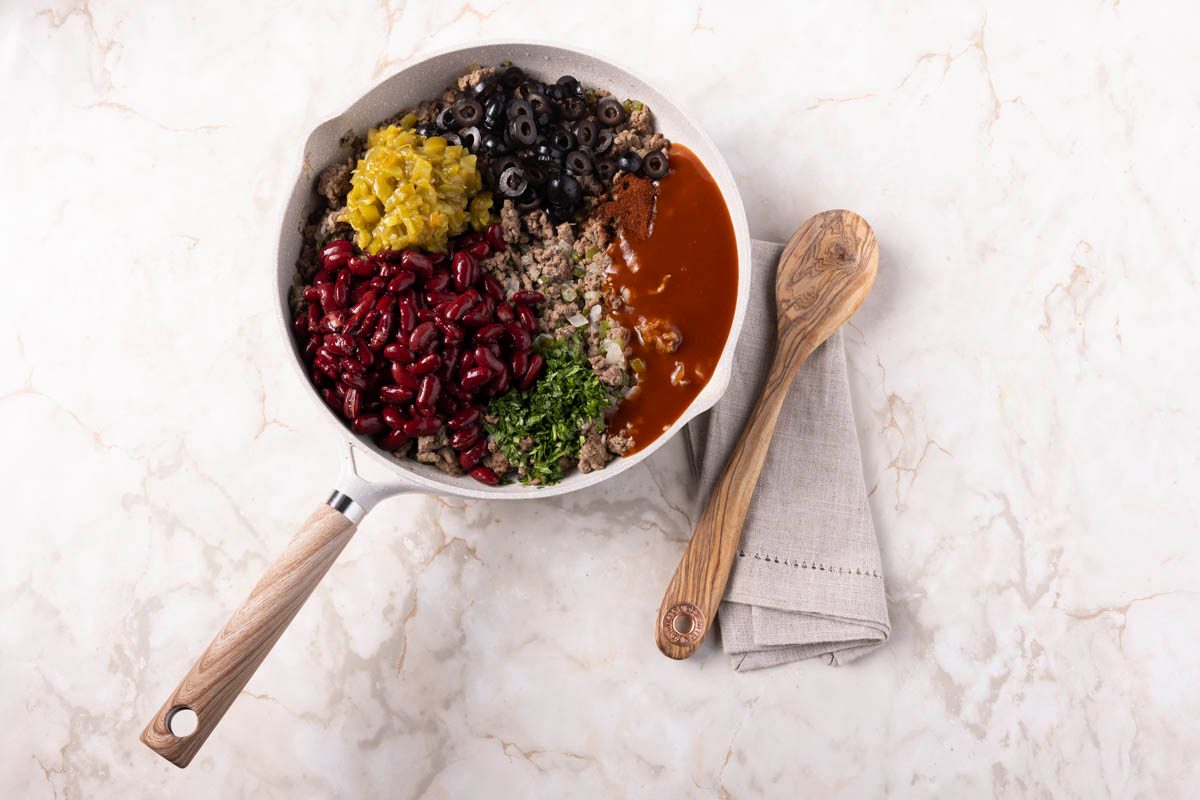 Saute the beef and vegetables for Tamale Casserole