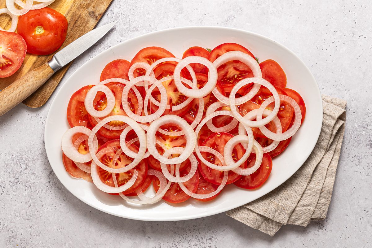 Oval Plate With Sliced Onions And Tomatoes