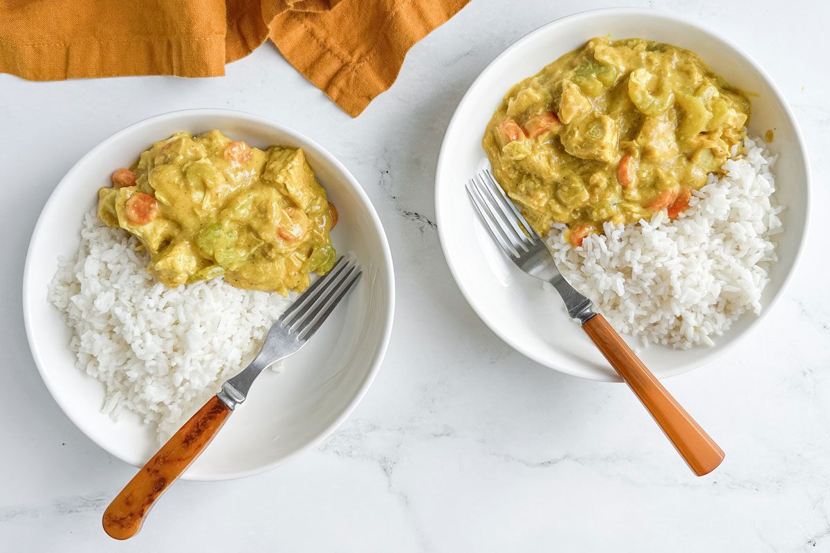 Taste of Home Turkey Curry in white bowls with rice