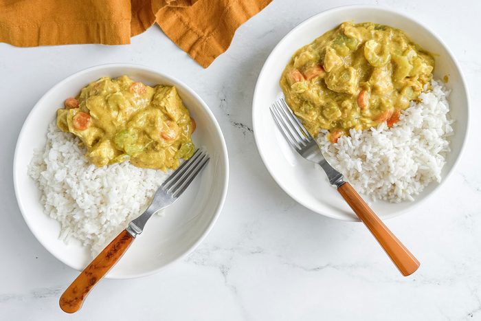 Taste of Home Turkey Curry in white bowls with rice