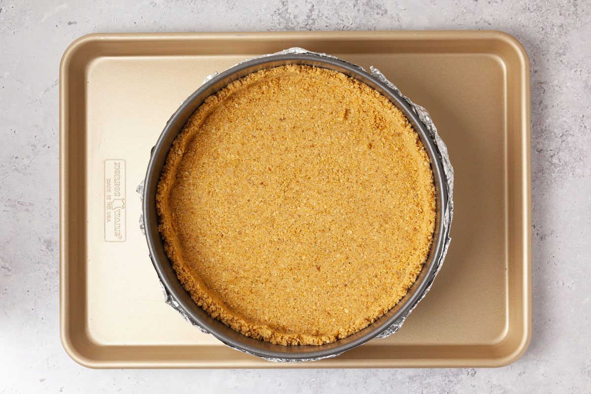 Step 1 of Taste of Home Ube Cheesecake is to bake the crust