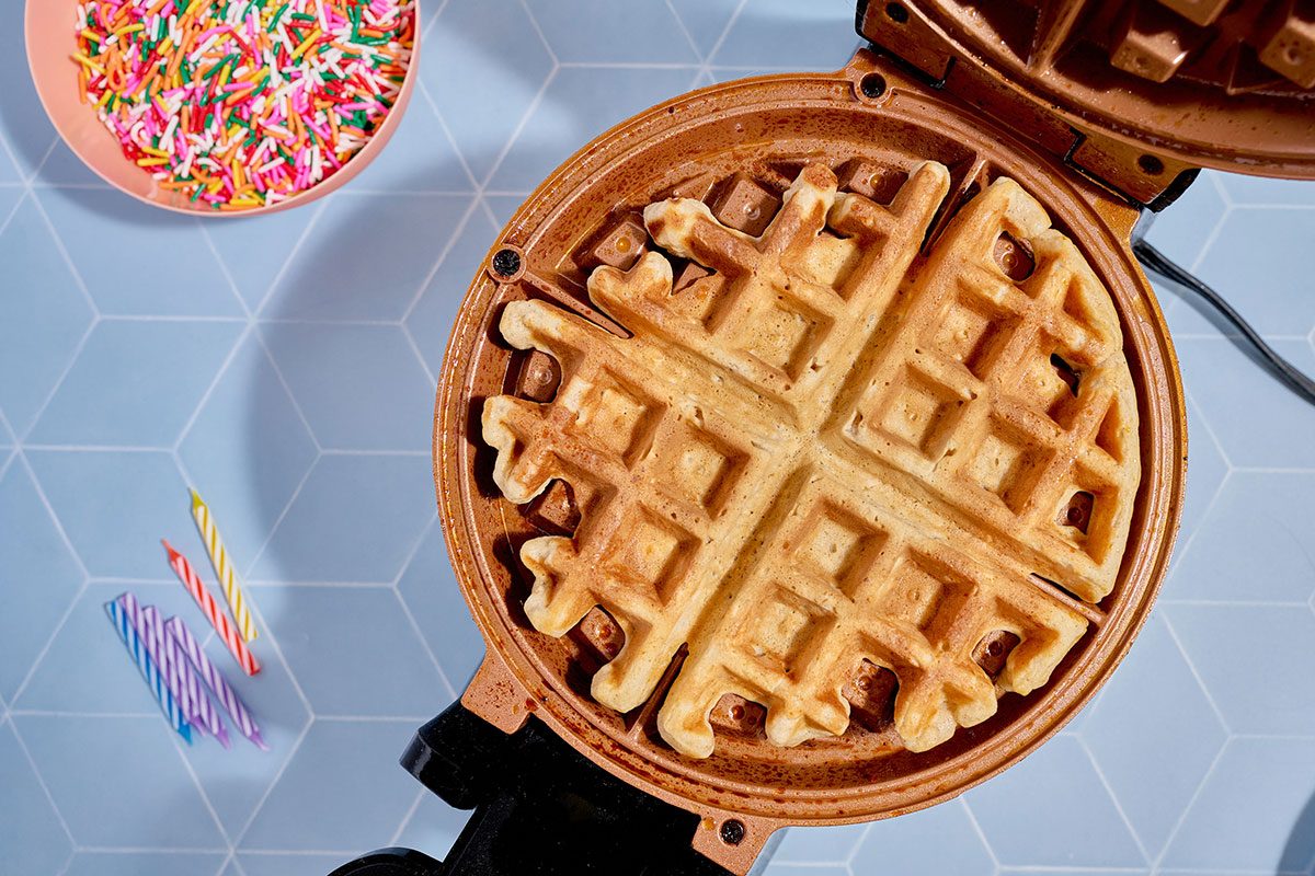 cooking a waffle in a waffle iron