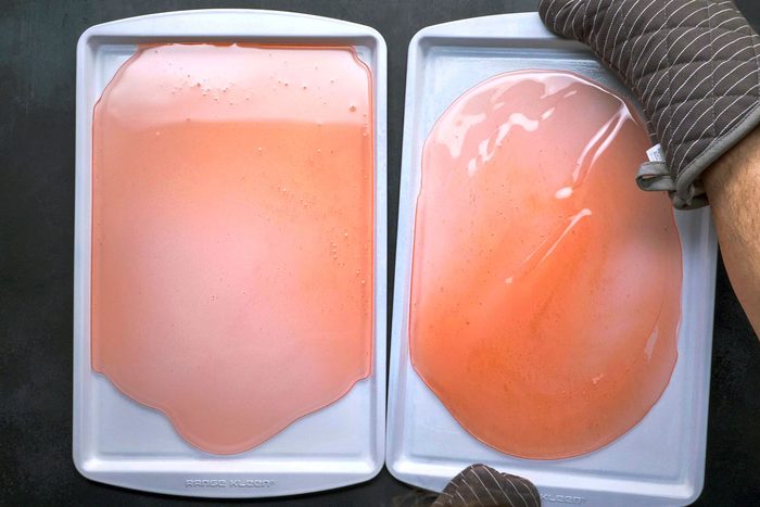 pouring the hot liquid onto prepared pans to cool