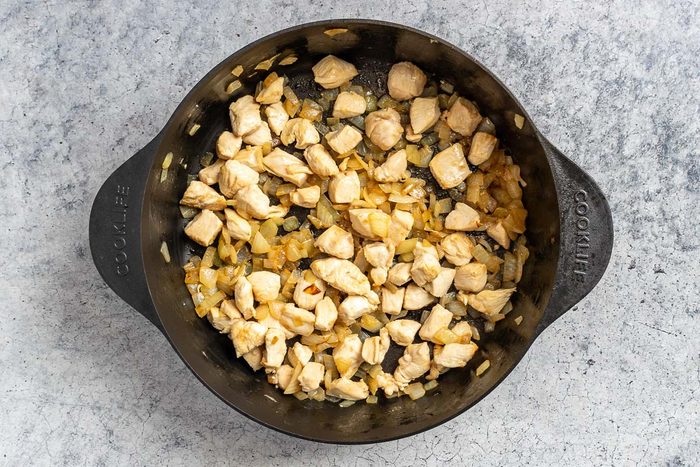 Taste of Home White Lasagna Soup photo of the sauteed chicken and onions.