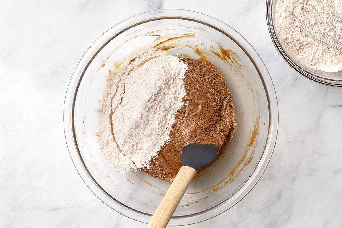 Dry ingredients being mixed with wet ingredients in a large bowl for step two of Wookie Cookie recipe for Taste of Home