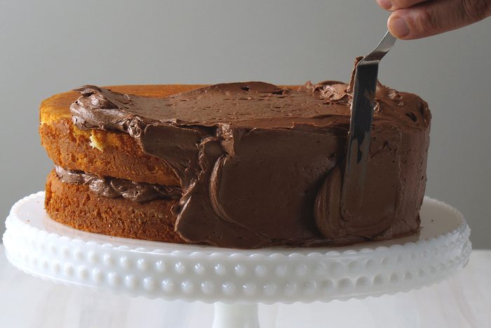 Chocolate frosting on yellow cake