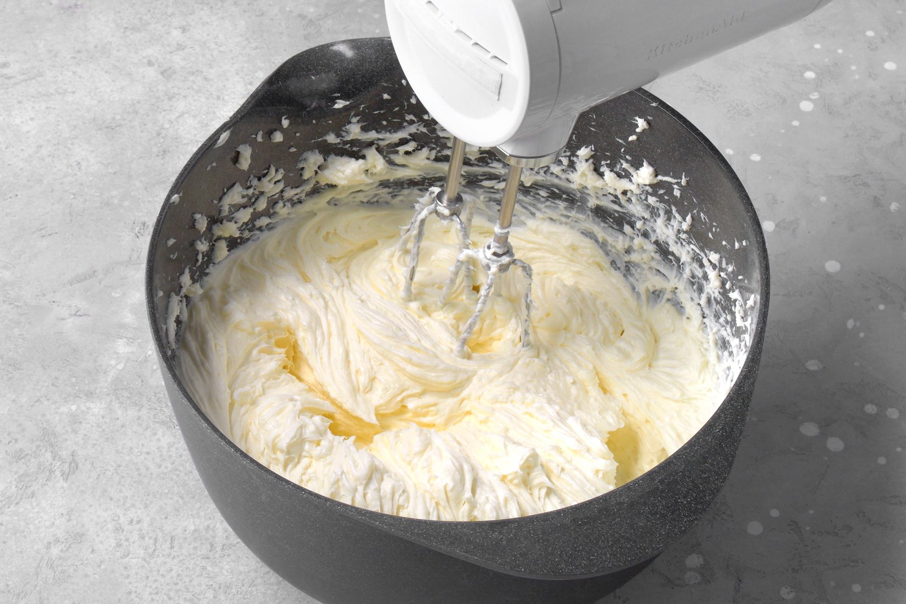 In the bowl of a stand mixer fitted with a paddle attachment, beat the cream cheese and 1 1/2 cups sugar on medium speed until the mixture is smooth.