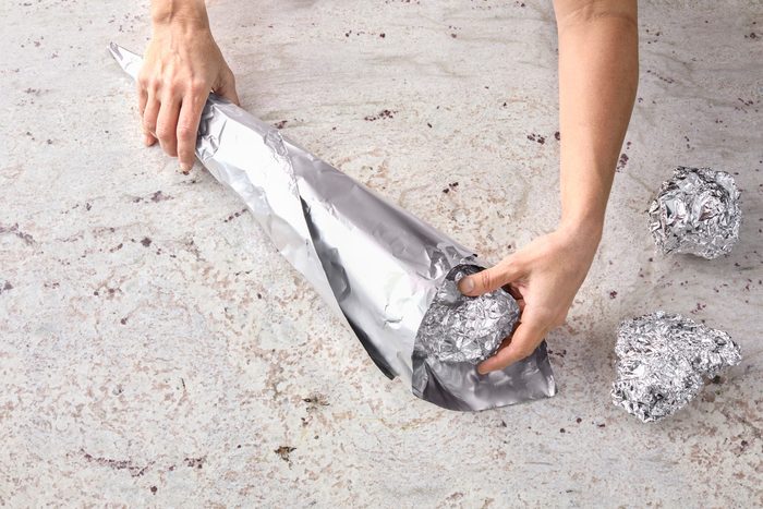 Insert balls of additional foil to provide support to cone.