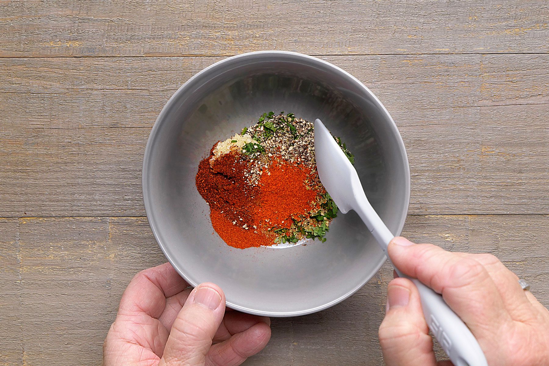 minced garlic, cilantro, salt, oregano, chili powder, cumin, paprika, pepper and cayenne pepper mixed together