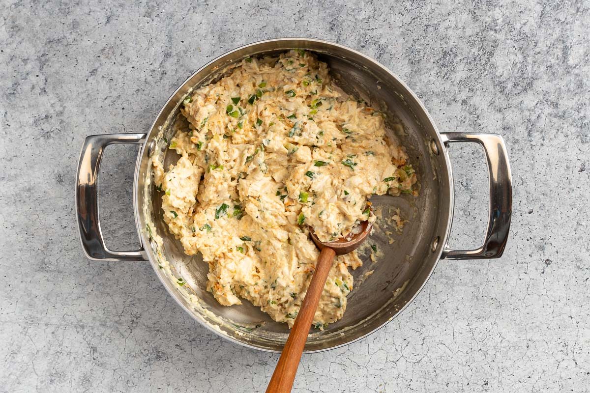 Taste of Home Chicken Croquettes photo of adding the chicken, vegetables, and seasonings.
