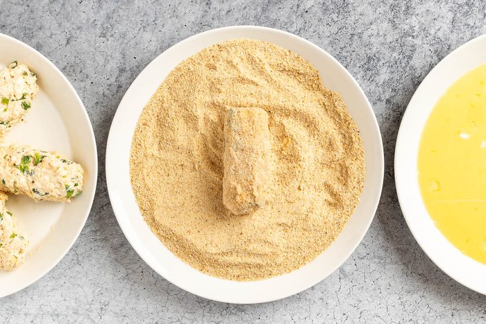 Taste of Home Chicken Croquettes photo of coating the croquettes.