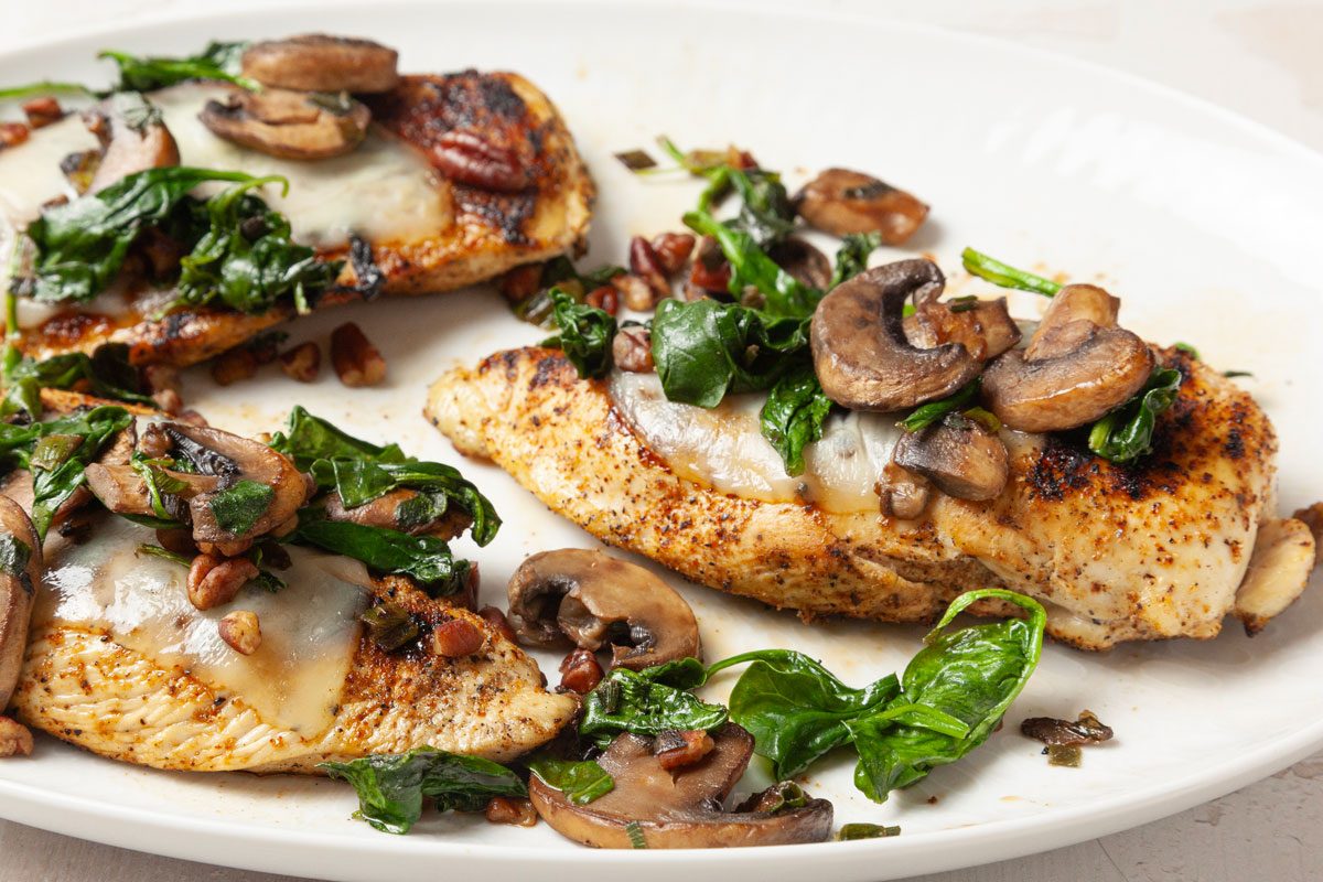 Full yield of Taste of Home Chicken with Spinach and Mushrooms on a white platter