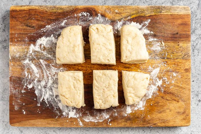 Taste of Home Creamed Chicken Over Biscuits photo of rolling out the dough and cutting into rectangles.