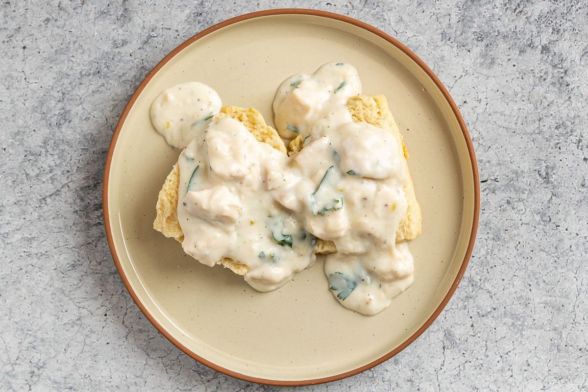 Taste of Home Creamed Chicken Over Biscuits photo of the creamed chicken spooned over biscuits.