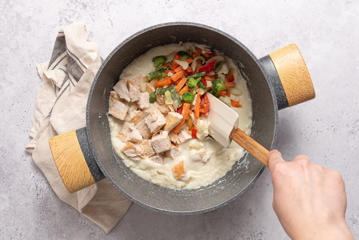 Turkey And Frozen Vegetables Mixed Inside Creamy Mixture