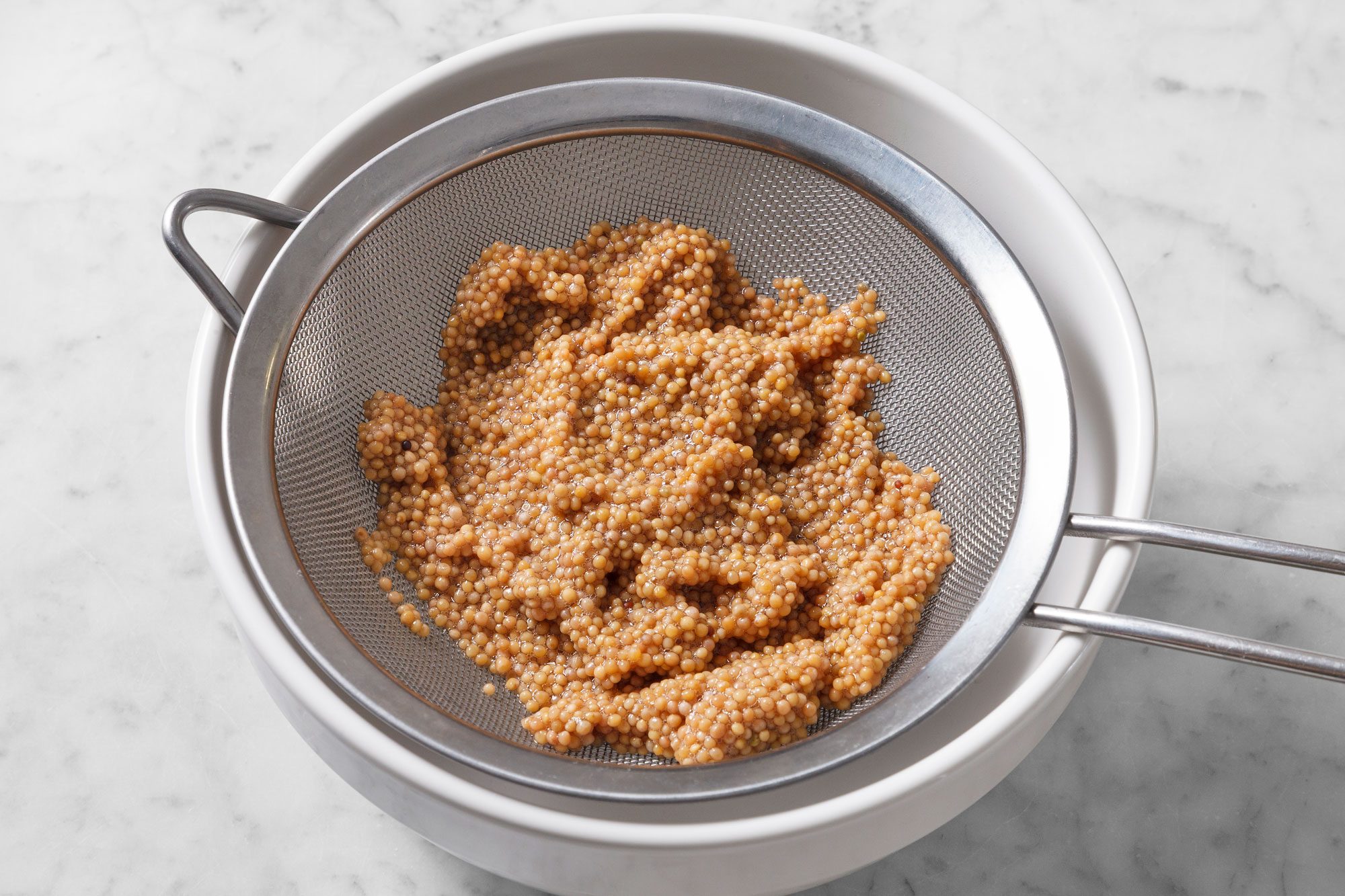 Strain seeds through a fine mesh strainer;