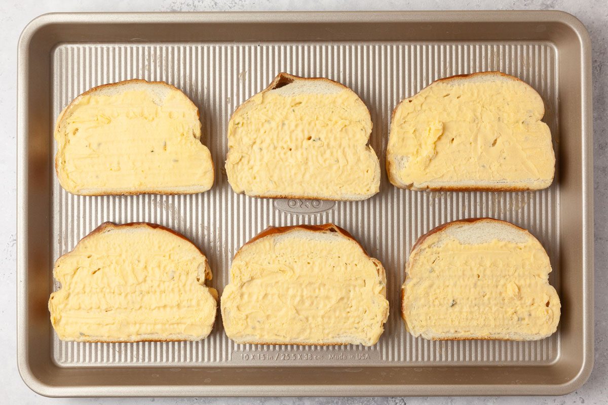 Step 1 of Taste of Home Garlic Bread Pizza is to bake the garlic bread