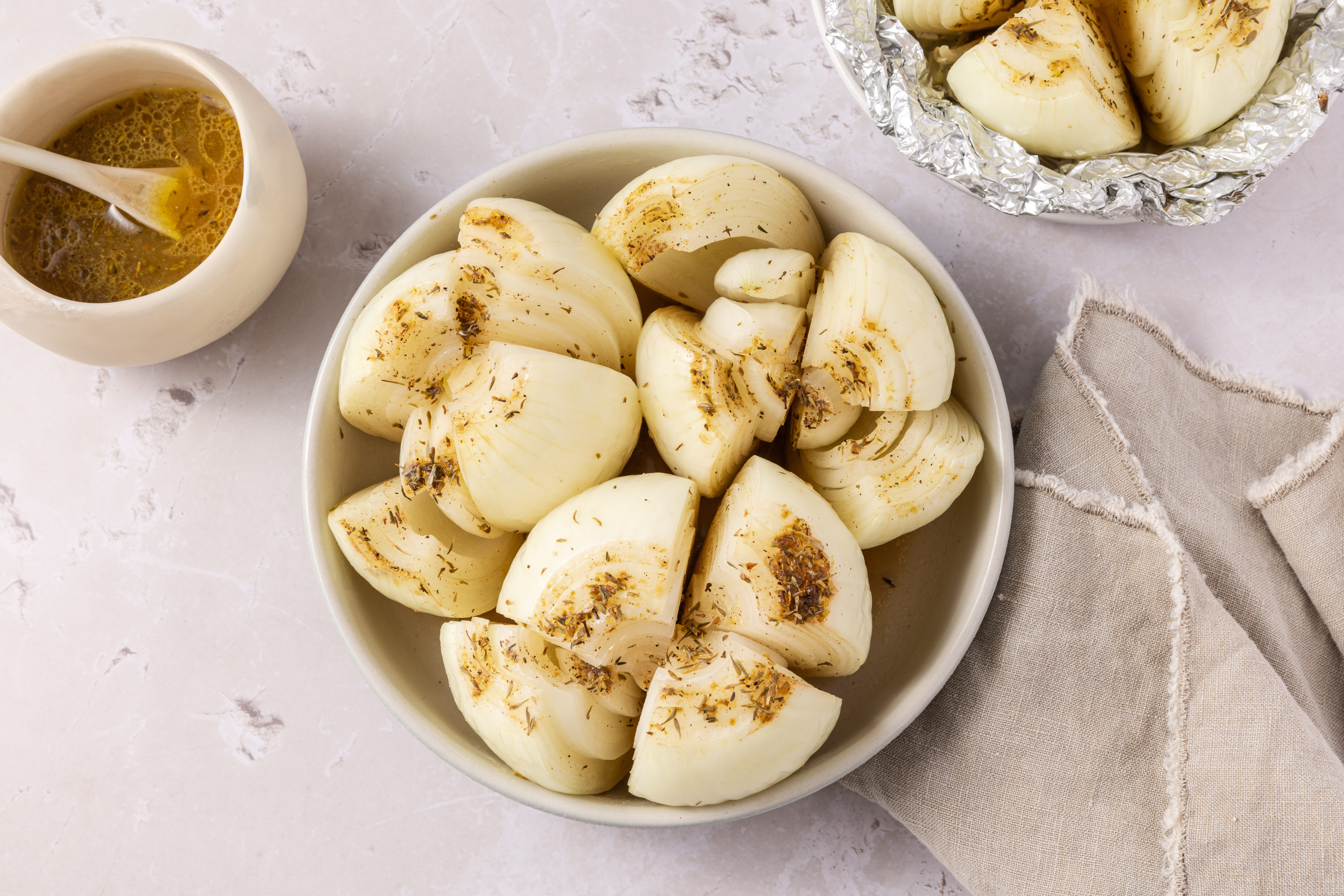 Grilled onions served in small plate and serving dish.