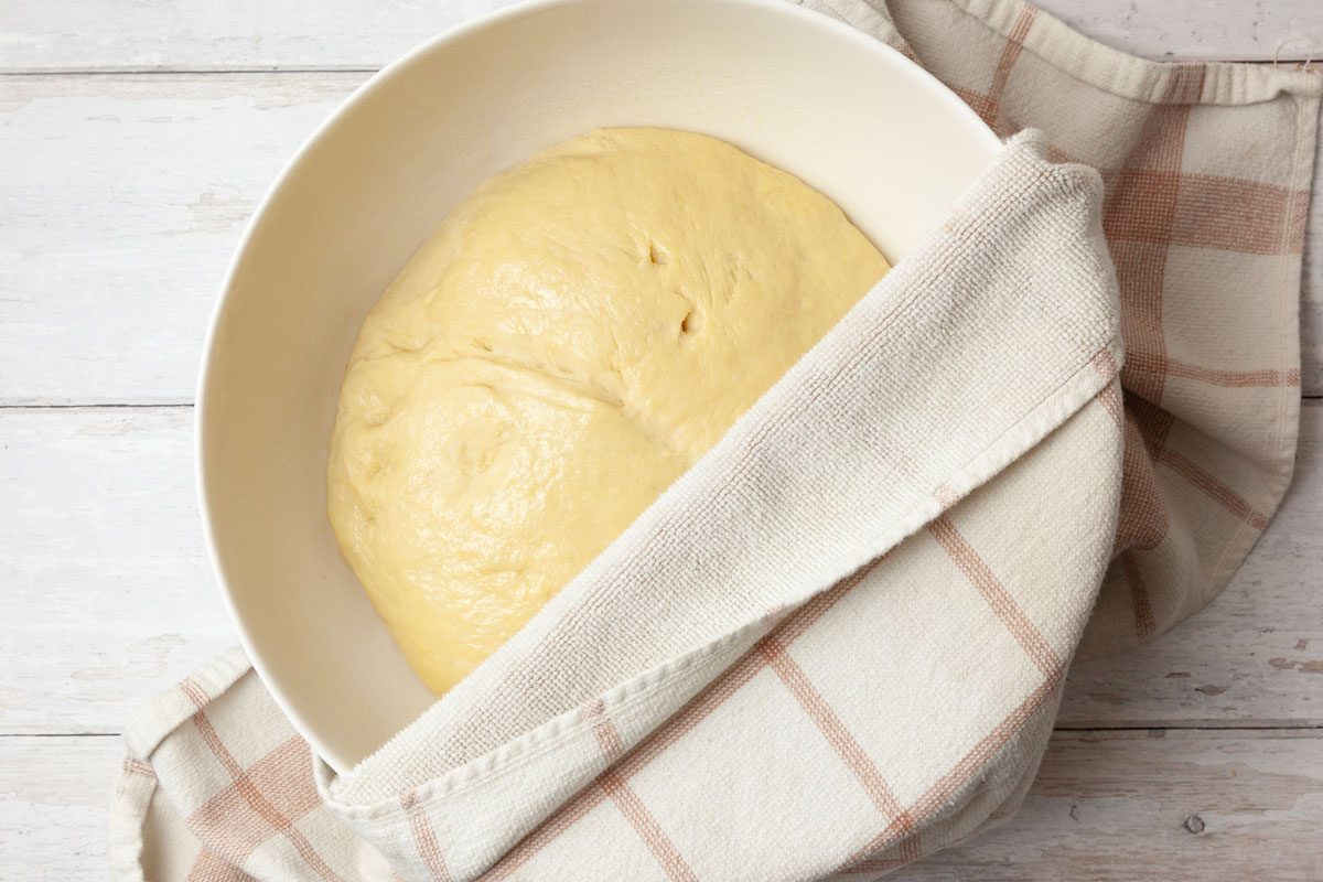 Step 4 of Taste of Home Hawaiian Sweet Bread is to knead the dough until smooth and elastic, 8 to 10 minutes. Cover and let the dough rise in a warm place until doubled, about 1 hour and 15 minutes.