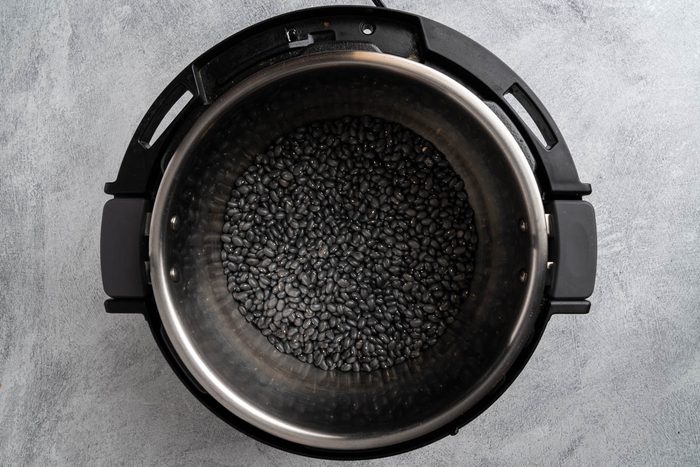 Taste of Home Instant Pot Black Beans recipe photo of the rinsed beans in a pressure cooker.