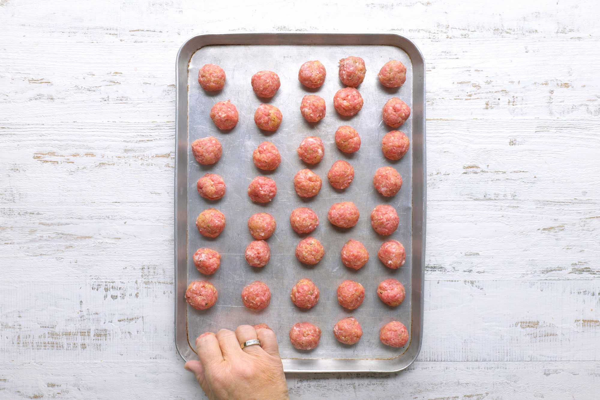 Place meatballs in a baking pan