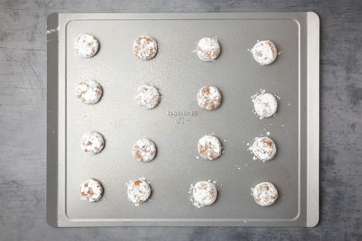 Step 3 of Taste of Home Molasses Crackle Cookies is to roll in powdered sugar, flattena and bake