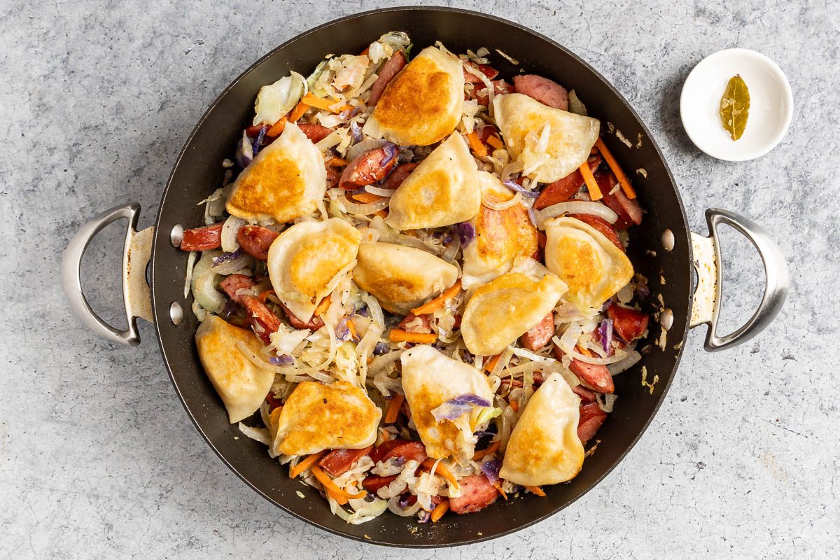 Taste of Home Pierogies and Sausage photo of the pierogies added to the skillet with all the ingredients.