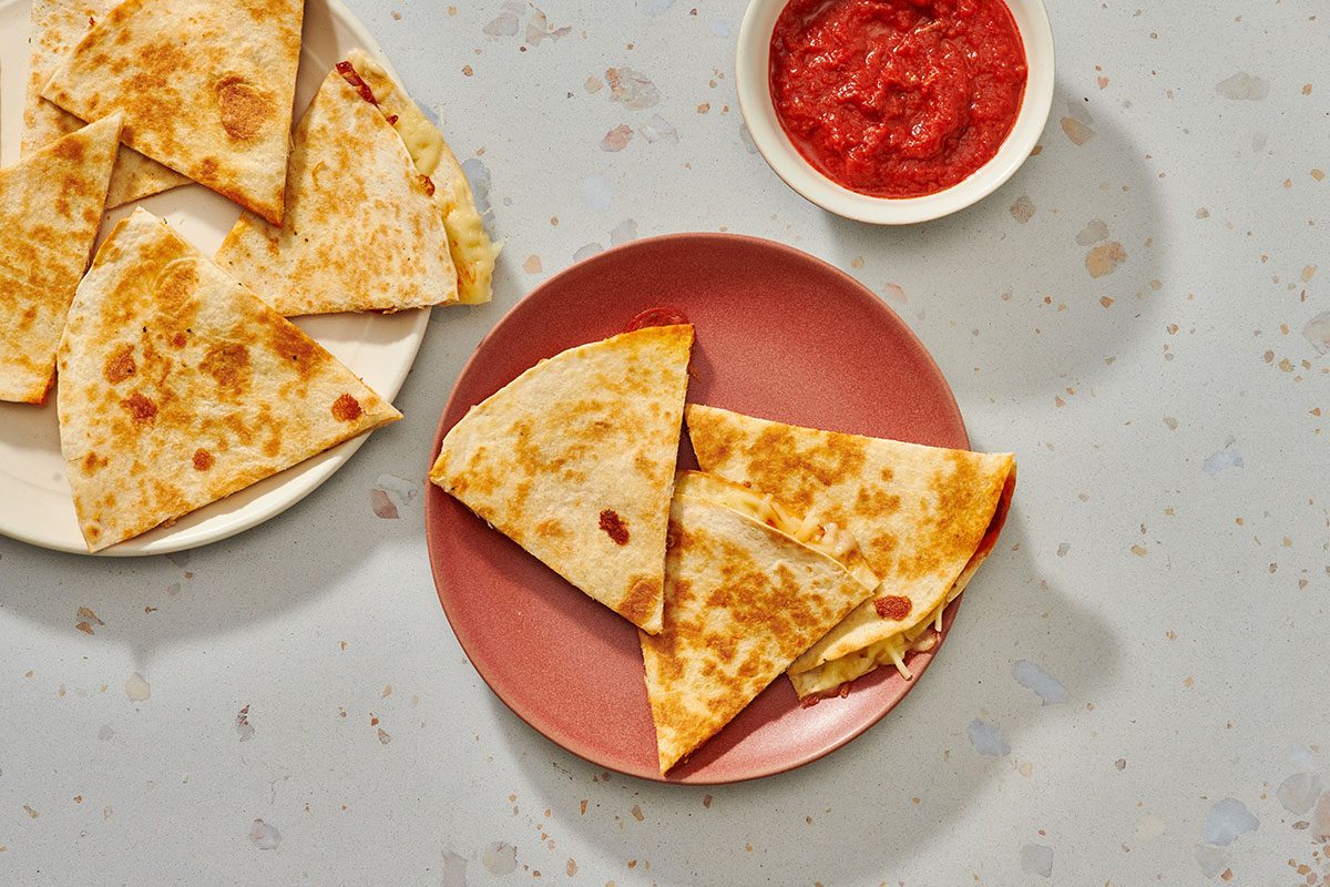 Quesadilla wedges served with spaghetti sauce