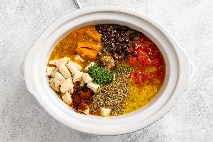 Taste of Home Pumpkin Chili photo of the all the ingredients added to a slow cooker.