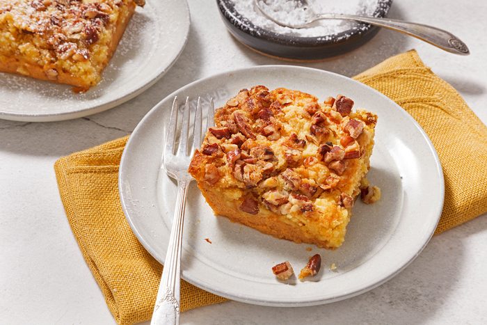 3/4th shot of pumpkin crunch cake slice on a plate.