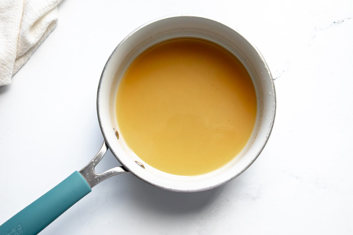 Overhead shot for Taste of Home Reindeer Chow, butter mixture melted in a small saucepan.