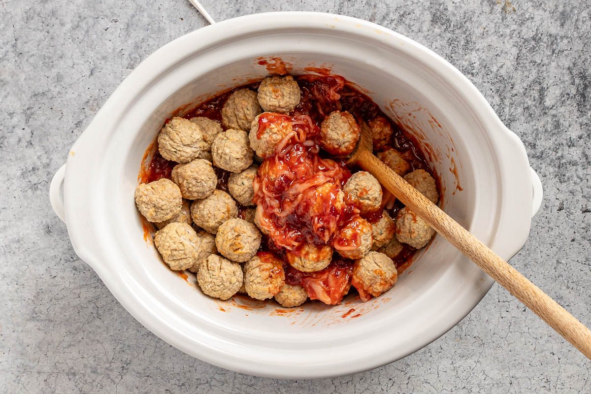 Taste of Home Sauerkraut Meatballs photo of combining the ingredients in a slow cooker.