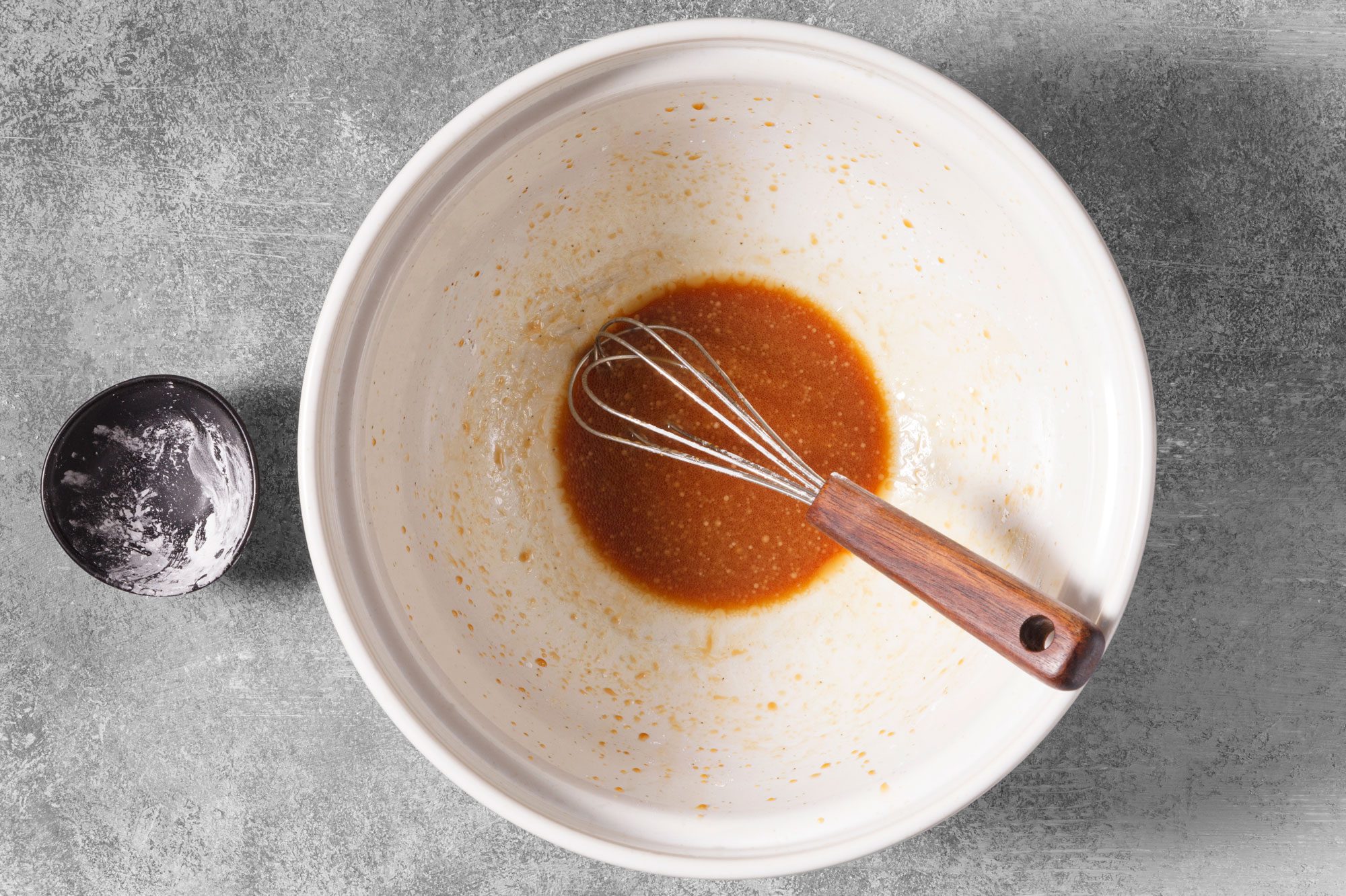 In a large bowl, whisk soy sauce, vineger, sesame oil, mirin if desired, pepper and salt.