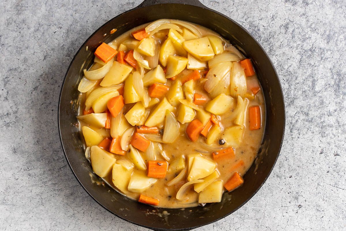Taste of Home Skillet Pork Chops photo of the veggies simmering in the soup sauce.
