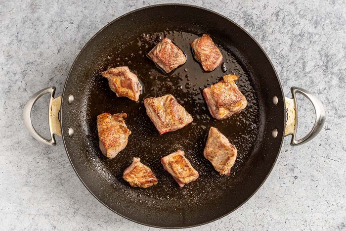 Taste of Home Slow Cooker Pork and Sauerkraut photo of the browned spareribs.