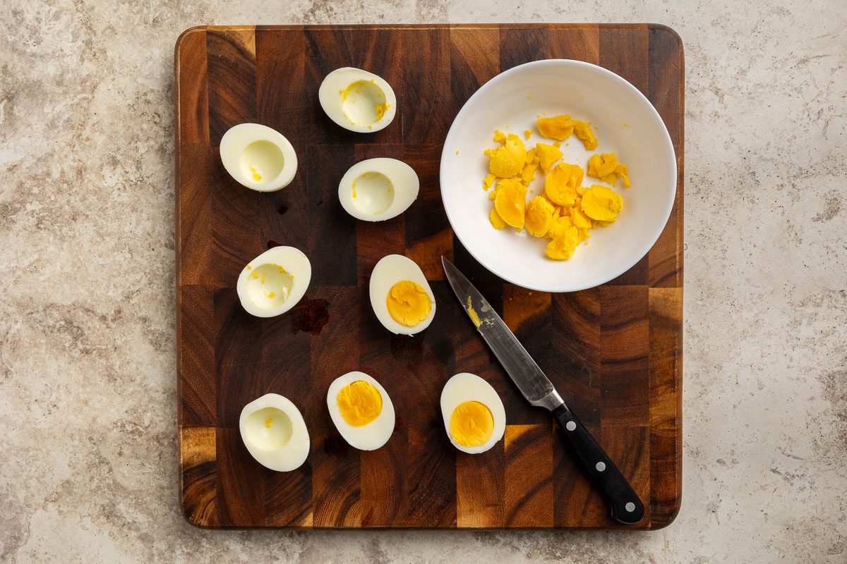 Taste of Home Sour Cream Potato Salad recipe photo of hard boiled eggs with yolks removed.