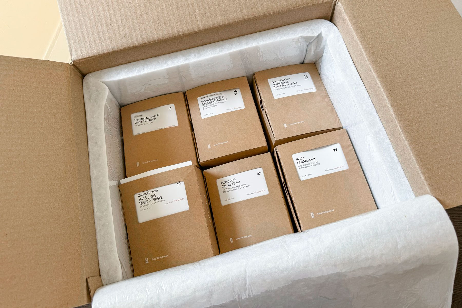 Tovola box opened to reveal meal boxes packed with foam