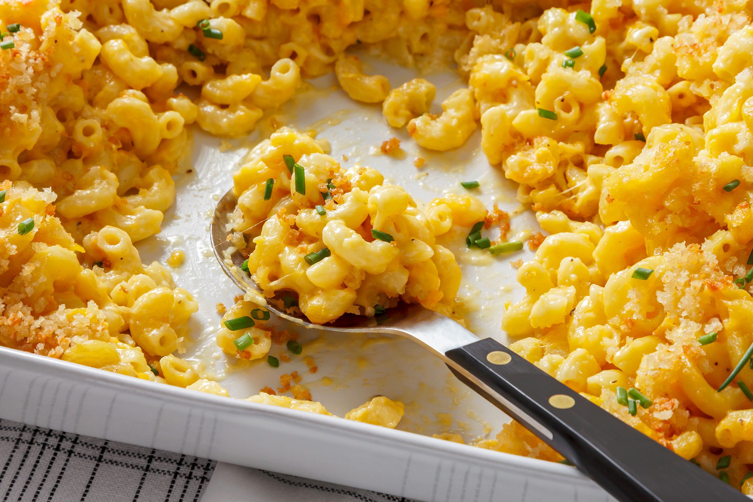 Close up shot of Truffle Mac And Cheese topped with chives