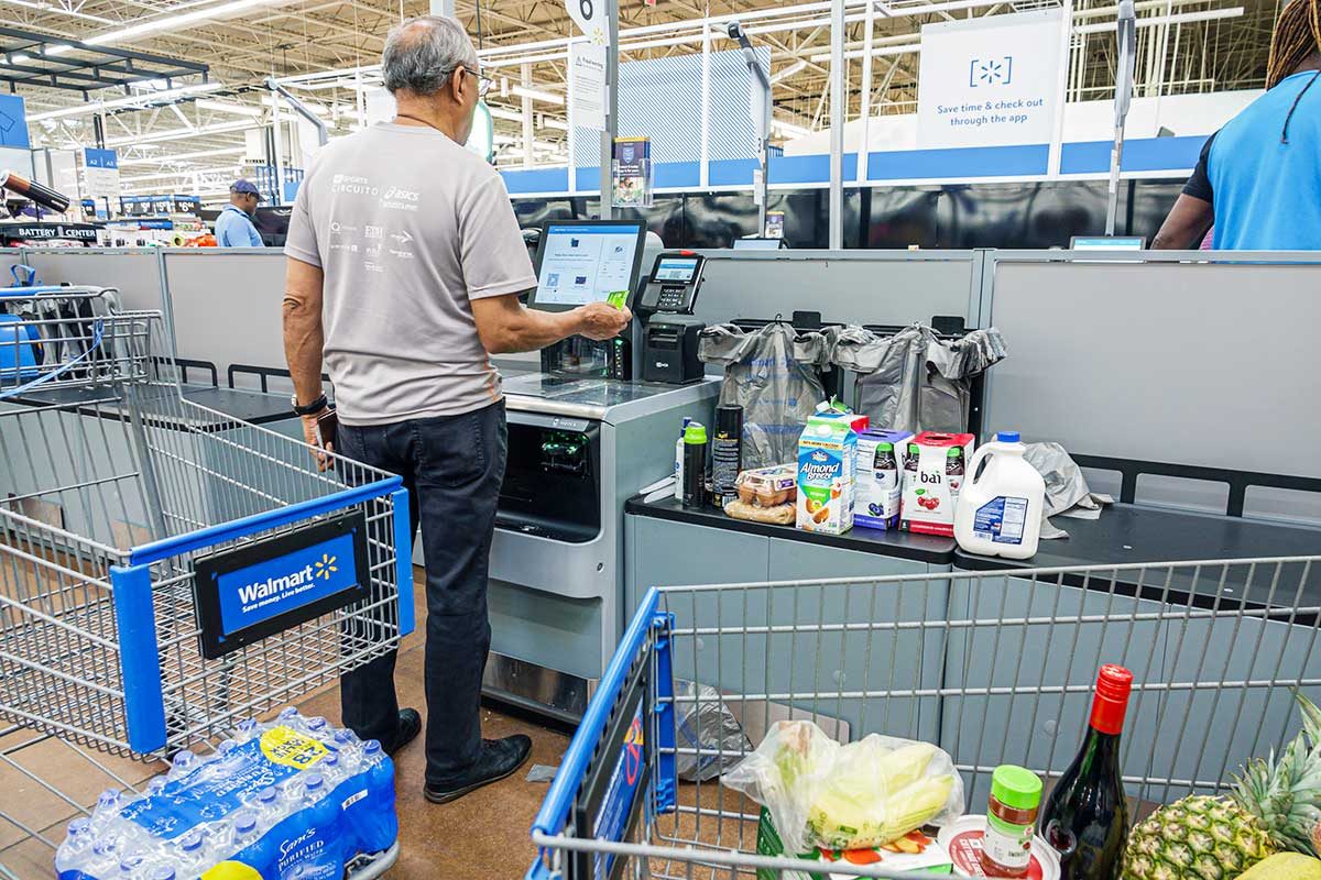 North Miami Beach, Florida, Walmart customer using Self Checkout. (Photo by: Jeffrey Greenberg/Universal Images Group via Getty Images)