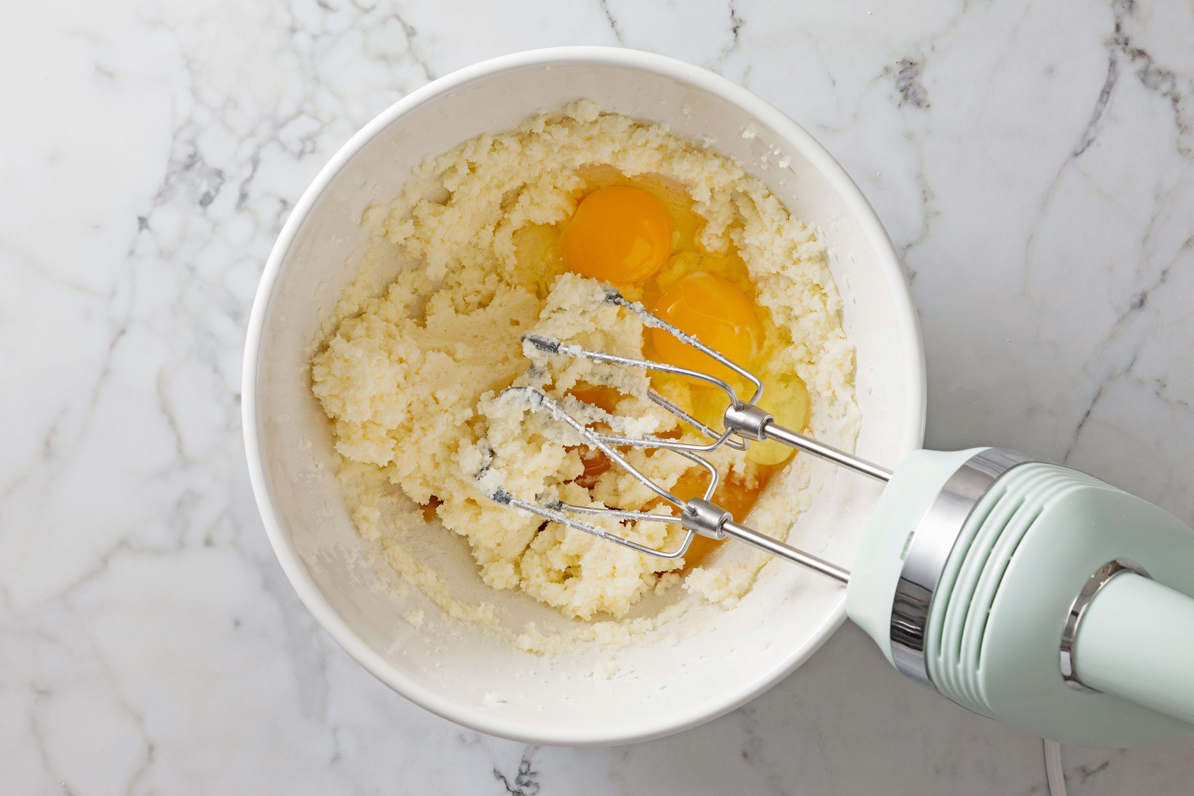 Creamed butter, sugar eggs and vanilla mixed together in a large bowl