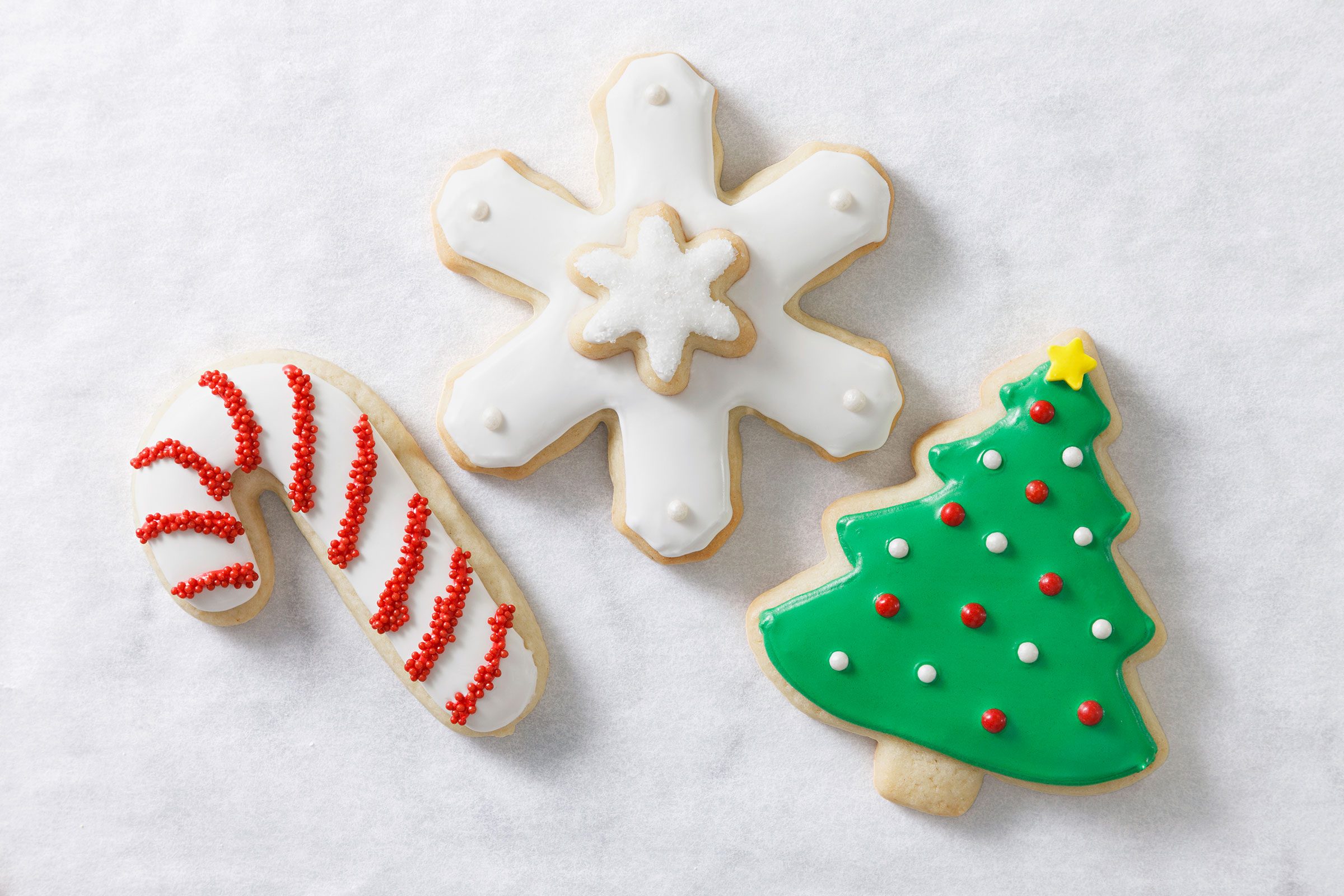 Decorated Christmas cutout cookies placed together